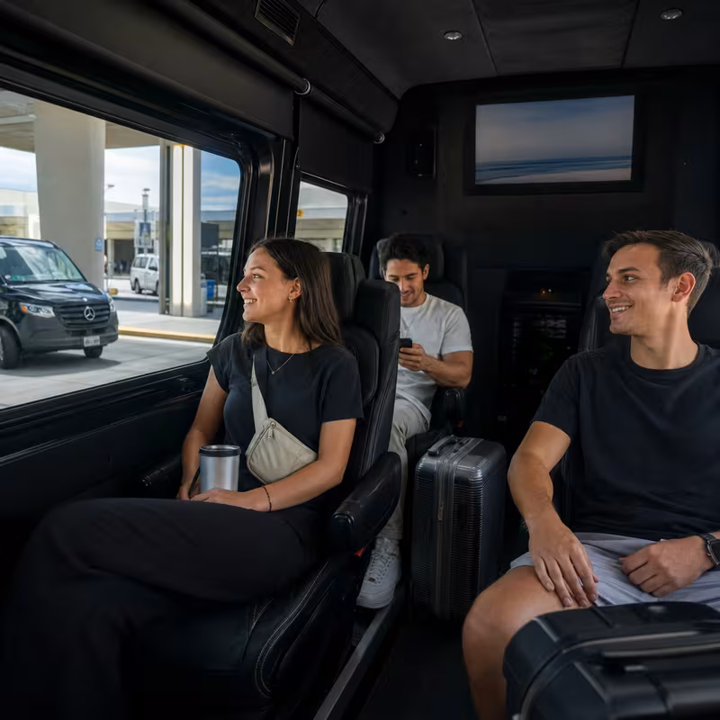 Passengers loading luggage while boarding an Pembroke Pines group shuttle