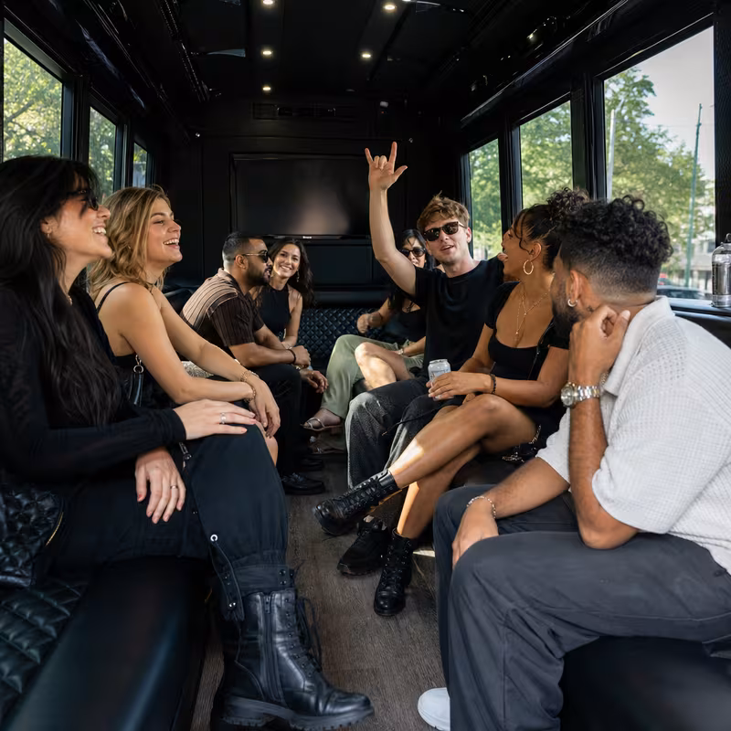 Group boarding a white charter bus for Concert Transportation transportation in Pembroke Pines