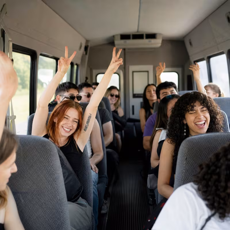 Party bus interior with wraparound leather seating and LED lighting in Pembroke Pines