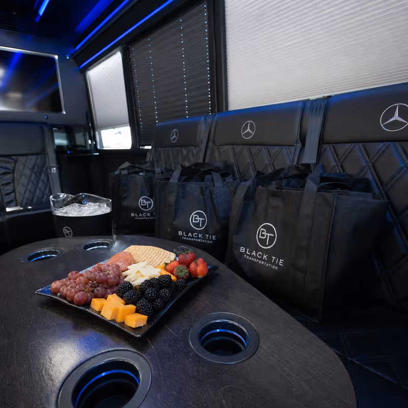 Party bus interior with wraparound leather seating and LED lighting in Pembroke Pines